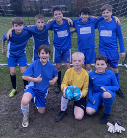 a boys football team wearing blue kit